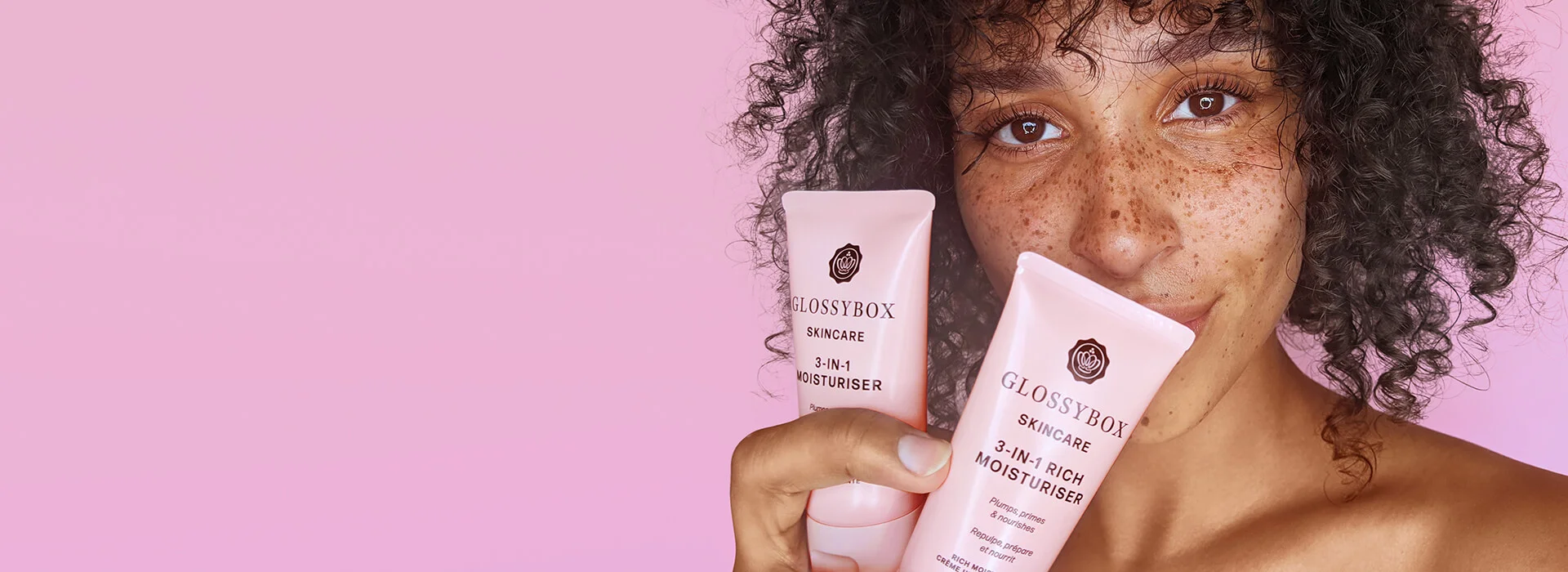 model holding glossybox skincare products